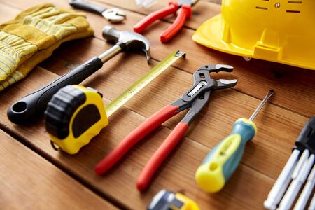 different work tools on wooden boards