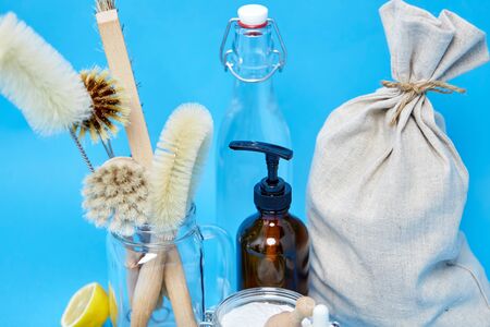 lemons, soap, washing soda, vinegar and brushes