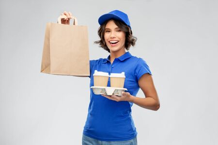 delivery woman with takeaway food and drinksの写真素材