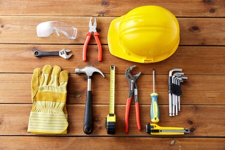 different work tools on wooden boards