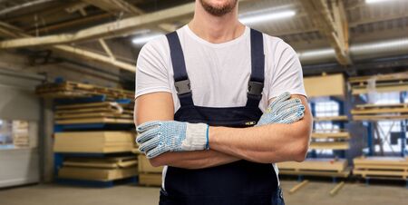 close up of male builder in overall and glovesの写真素材