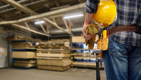 worker or builder with helmet and working toolsの写真素材