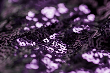 shimmering violet fabric with sequins background