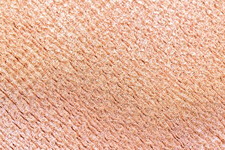party, texture and holidays concept - rose gold glitter background