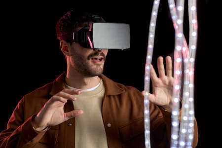 future, technology and people concept - happy smiling young man with mustaches in virtual reality...