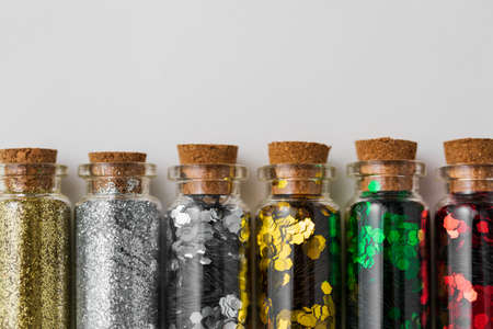 set of glitters in bottles over white backgroundの写真素材