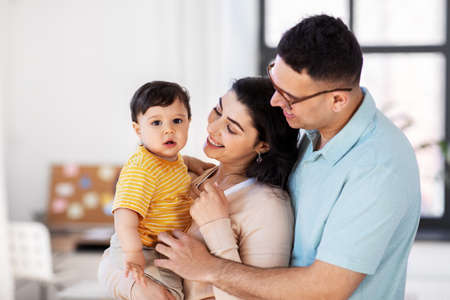 happy family with child at homeの写真素材