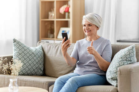 senior woman having video call on smartphoneの写真素材