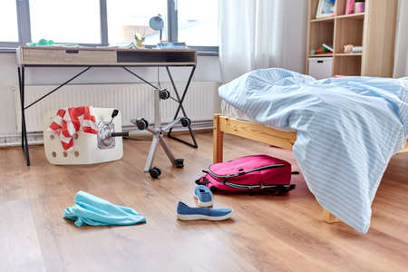 messy home or kids room with scattered stuffの写真素材