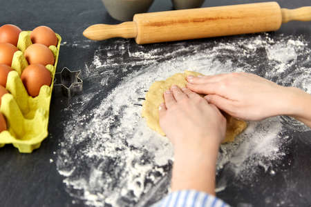 hands making shortcrust pastry dough on tableの写真素材