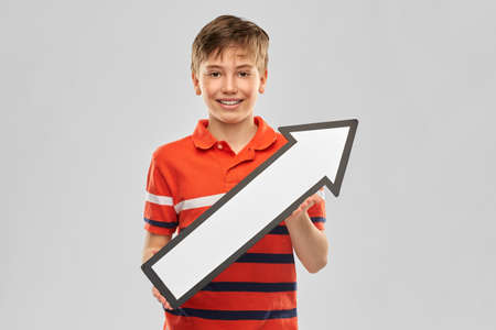 happy boy holding big white rightwards thick arrow