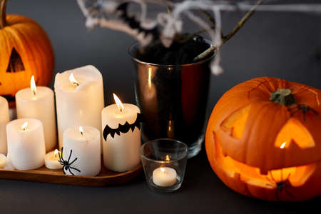 pumpkins, candles and halloween decorationsの写真素材