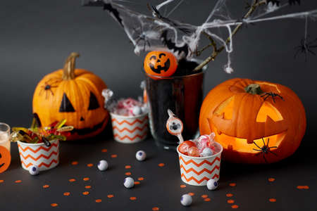pumpkins, candies and halloween decorationsの写真素材