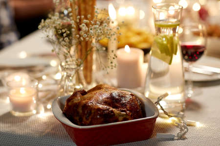 roast chicken on served table at home dinner partyの写真素材