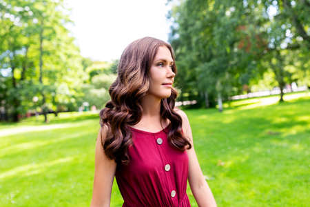 portrait of beautiful woman at summer park