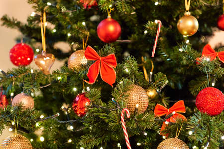 decorated artificial christmas tree at home