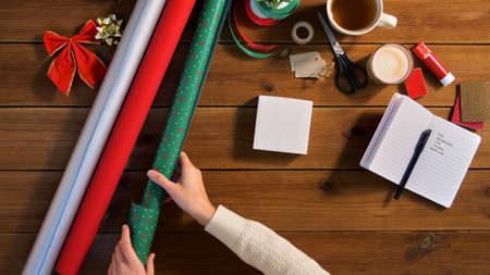 hands setting stuff for christmas gifts wrappingの写真素材