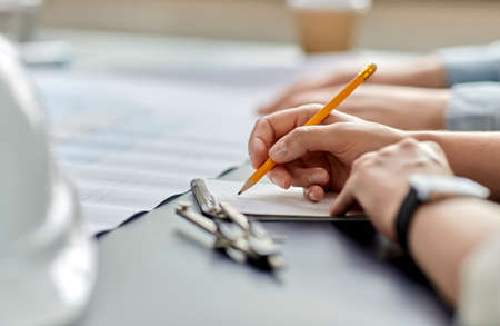 architect with notebook working at office