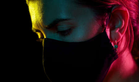 young woman wearing reusable protective mask