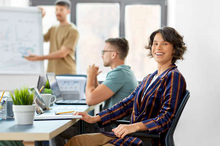 smiling businesswoman at office conference