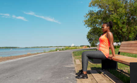 african american woman doing sports at seasideの写真素材