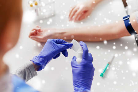 doctor and patient preparing for blood test