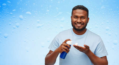 happy african american man with shaving cream