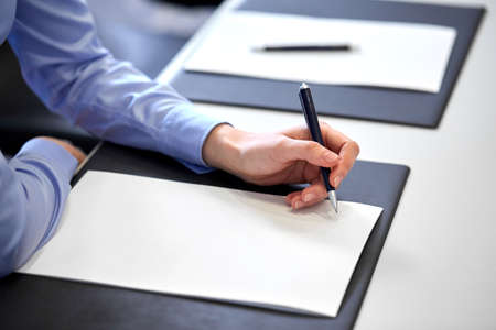 close up of businesswoman with paper at office