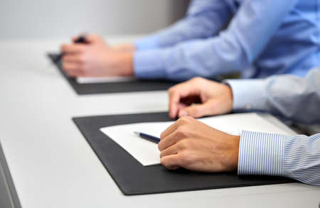 close up of businessman with papers at office