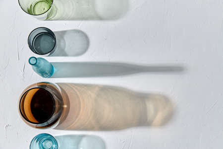 glassware dropping shadows on white surfaceの写真素材