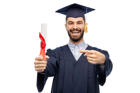 male graduate student in mortar board with diplomaの写真素材