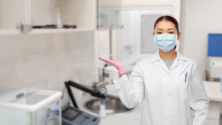 asian female doctor or scientist in medical maskの写真素材
