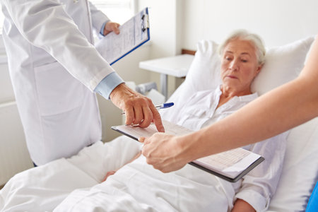 senior woman and doctors at hospitalの写真素材
