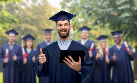 male graduate student or bachelor with tablet pcの写真素材