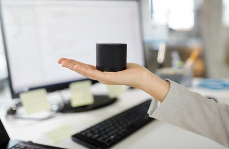 businesswoman using smart speaker at office