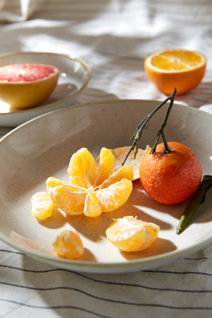 still life with mandarins and grapefruit on plateの写真素材