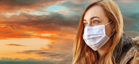 young woman wearing protective medical mask