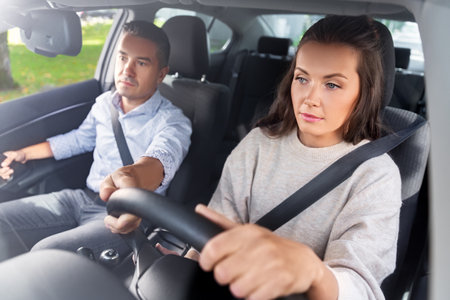 car driving school instructor teaching womanの写真素材