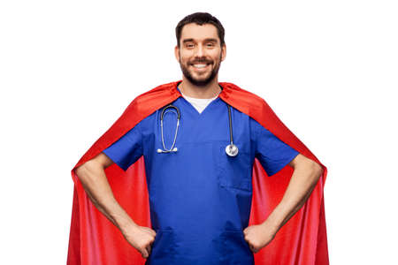 smiling doctor or male nurse in superhero capeの写真素材