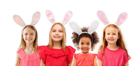 happy girls wearing easter bunny ears headbands