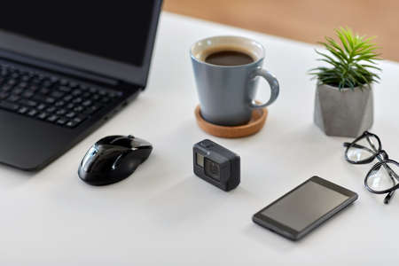 action camera and other media on office table