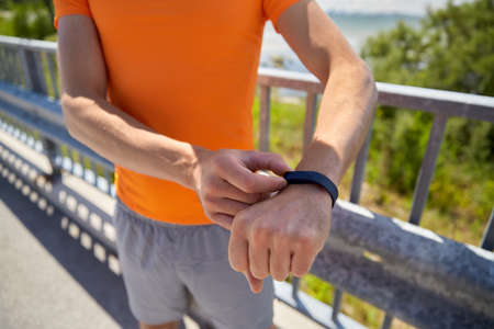 close up of man with fitness tracker outdoors