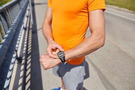 close up of man with fitness tracker outdoors