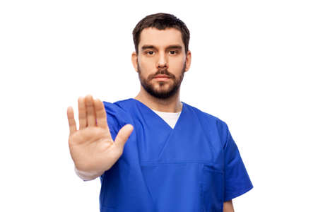 doctor or male nurse showing stop gesture