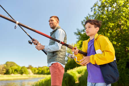 father and son fishing on river