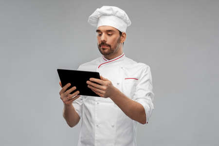male chef with tablet pc computerの写真素材