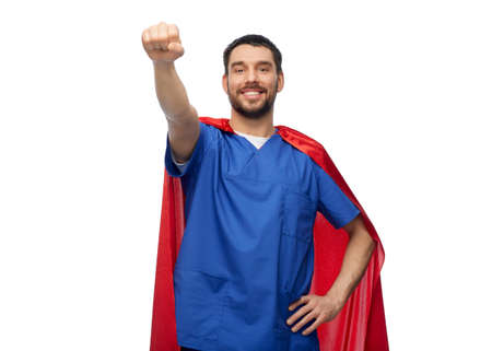 smiling doctor or male nurse in superhero capeの写真素材