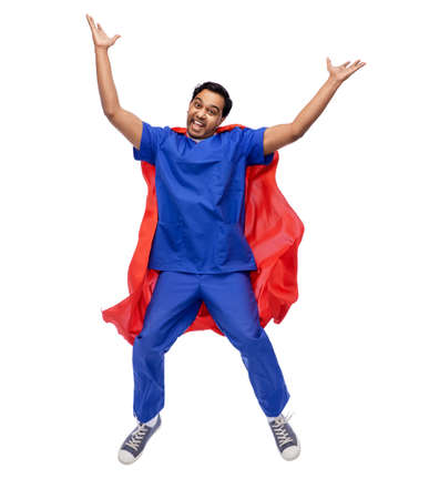 doctor or male nurse in superhero cape jumpingの写真素材