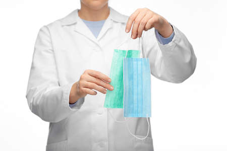 female doctor showing two medical masksの写真素材
