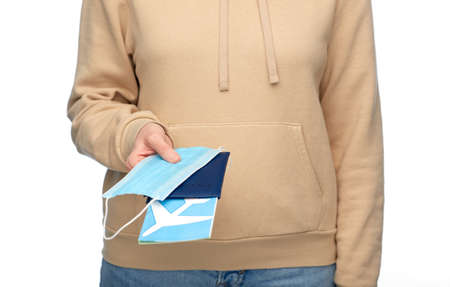 woman with mask, passport and air ticketの写真素材